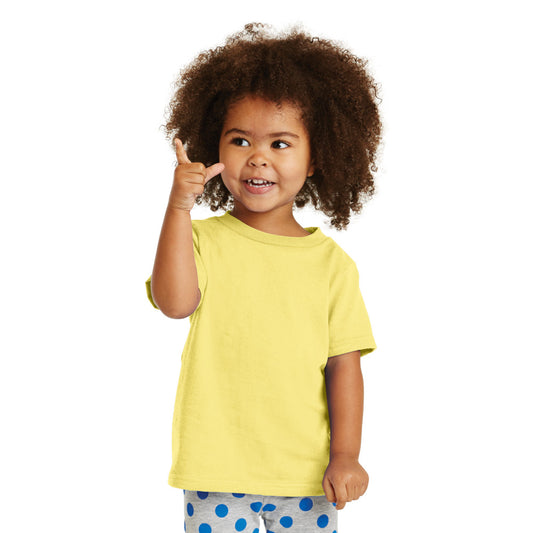 smiling child in port & company toddler core cotton tee yellow