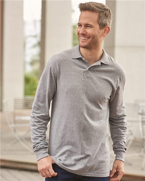 smiling man wearing grey jerzees long sleeve polo