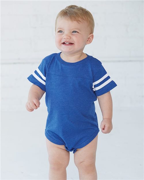 smiling baby wearing rabbit skins infant football jersey bodysuit in vintage royal white