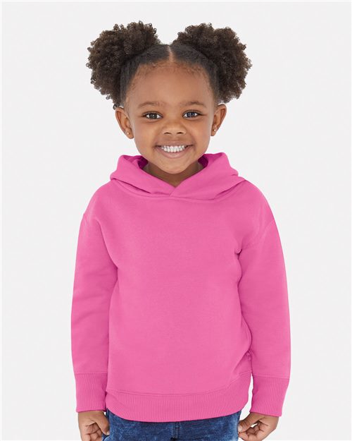 smiling toddler wearing rabbit skins toddler hoodie in raspberry pink
