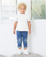 toddler wearing white bella canvas toddler short sleeve