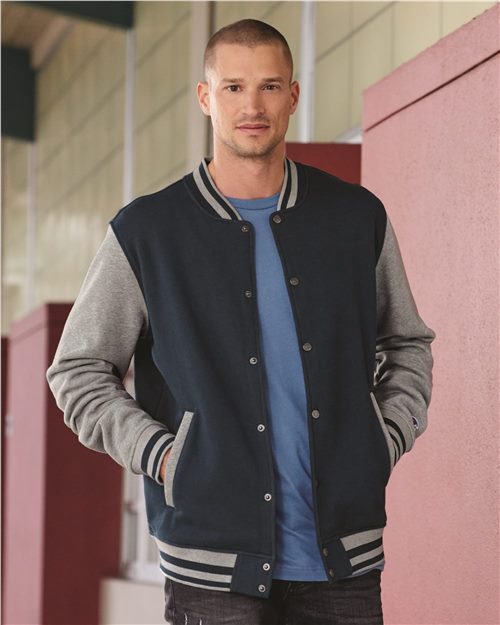smiling male model wearing champion bomber jacket in navy oxford