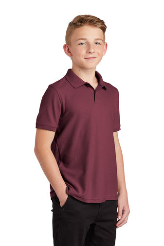 child model wearing port authority youth core classic pique polo burgundy