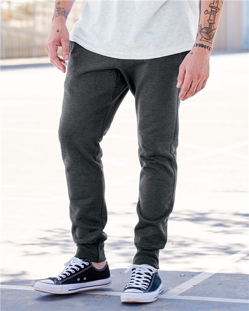 model wearing champion reverse weave jogger in charcoal heather grey