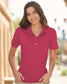 smiling woman wearing pink jerzees 50/50 polo