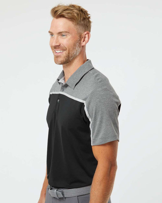 smiling man wearing black and grey adidas colorblock polo