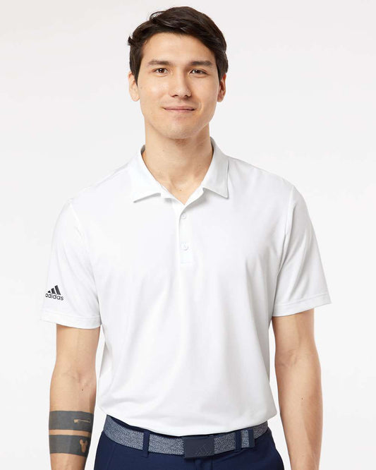 man wearing white adidas ultimate polo