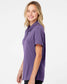 smiling woman wearing purple womans adidas ultimage polo