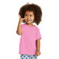 smiling child in port & company toddler core cotton tee candy pink