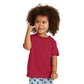 smiling child in port & company toddler core cotton tee red