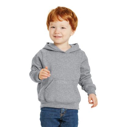 smiling child in port & company toddler hoodie athletic heather