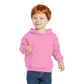smiling child in port & company toddler hoodie candy pink