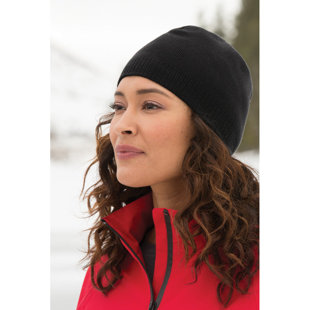 female model wearing port authority cotton beanie in black