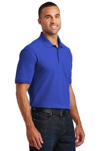 smiling male model wearing port authority core classic pique pocket polo in true royal