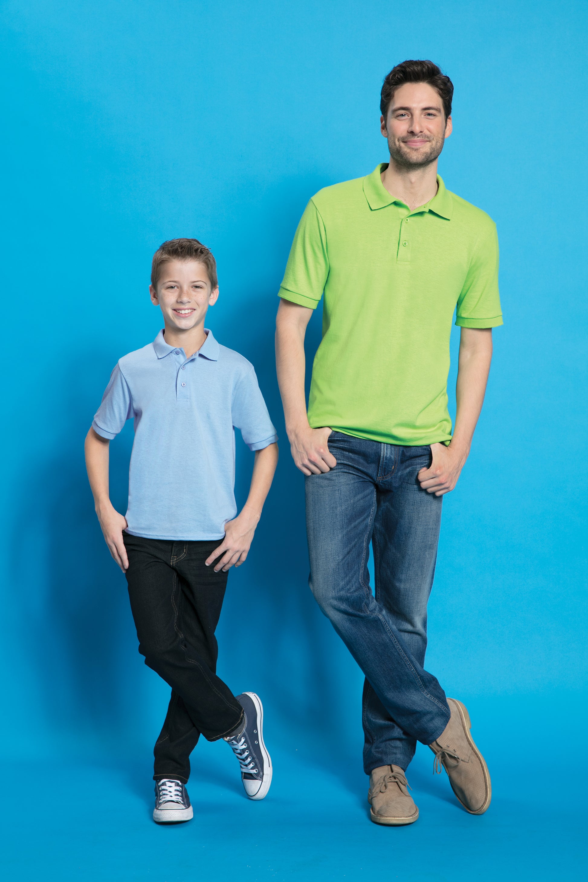 adult and child models wearing port & company knit polo in lime and light blue