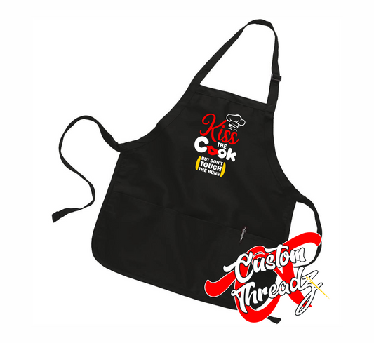 black apron with kiss the cook DTG printed design