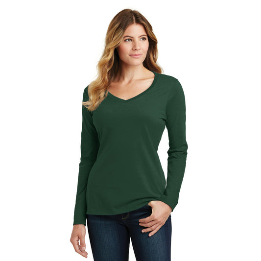 smiling model wearing port & company womens fan favorite v-neck long sleeve tee in forest green