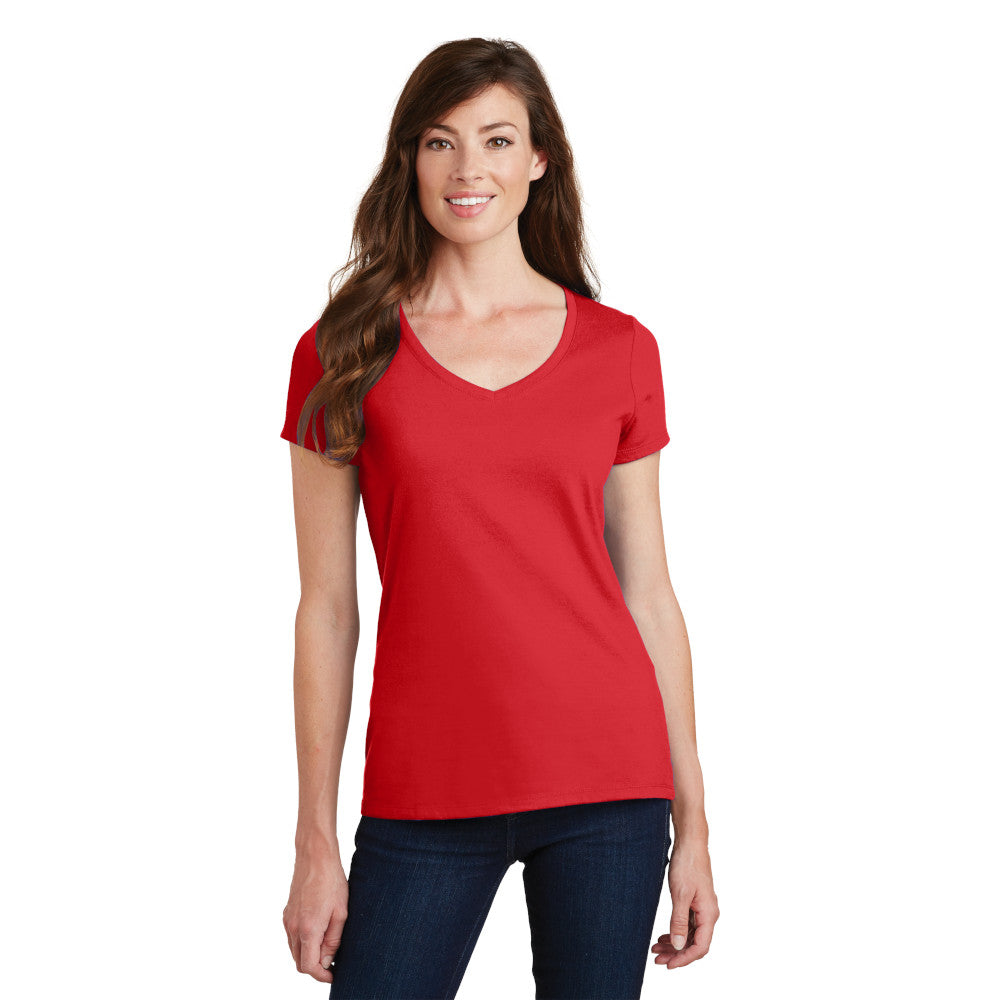 smiling model wearing port & company womens fan favorite v-neck tee in bright red