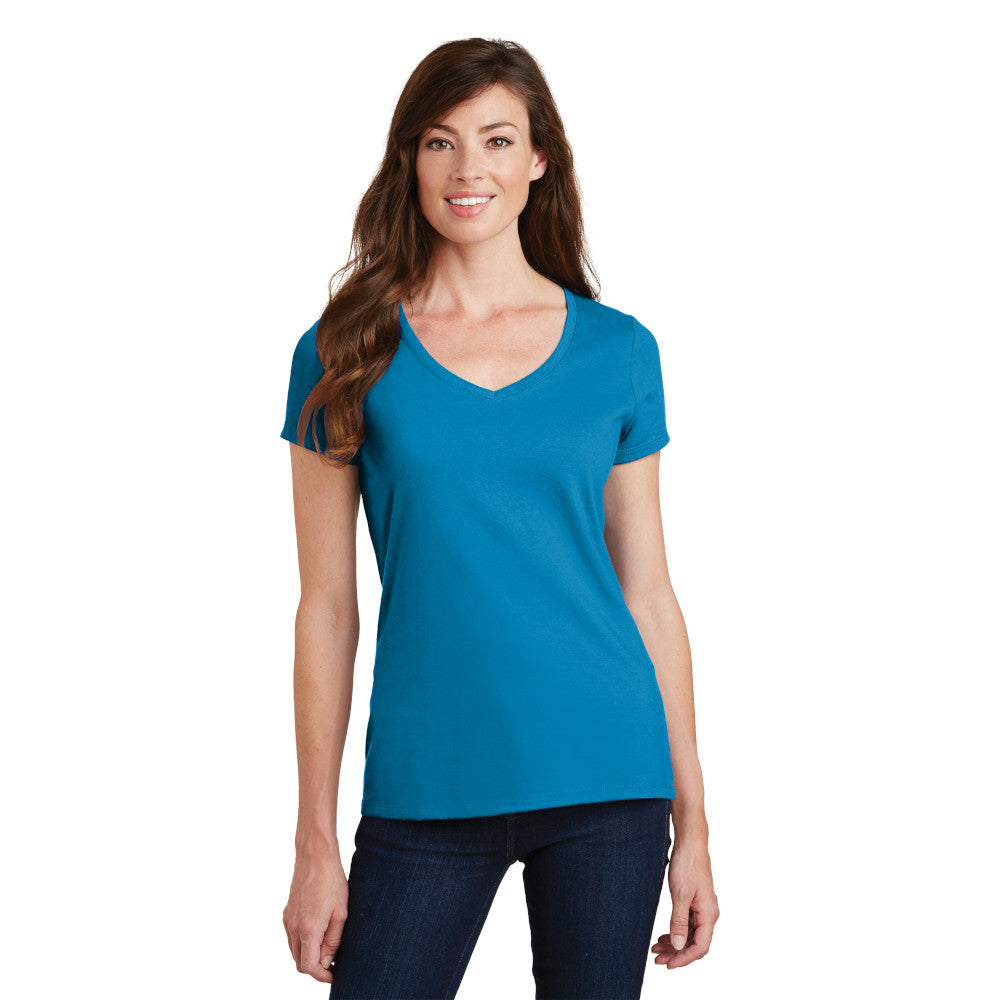 smiling model wearing port & company womens fan favorite v-neck tee in sapphire