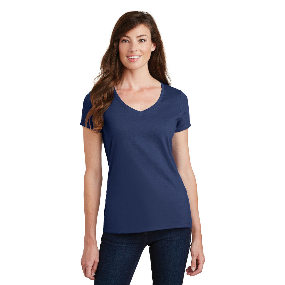 smiling model wearing port & company womens fan favorite v-neck tee in team navy