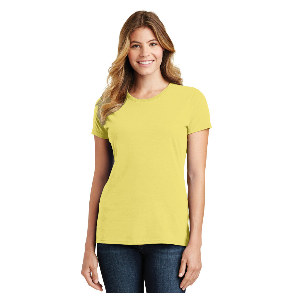 smiling model wearing port & company womens fan favorite tee in yellow