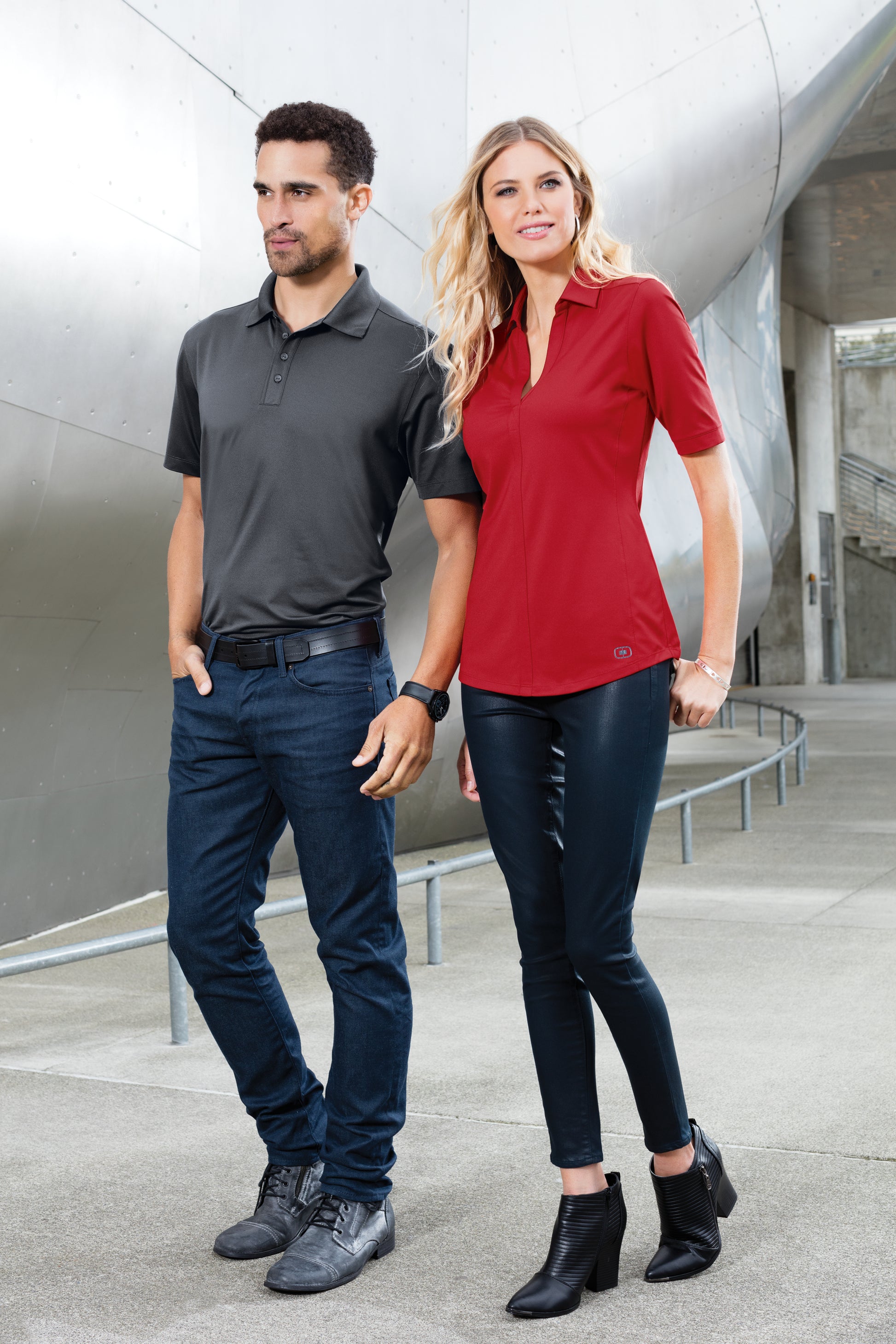 male and female models wearing ogio metro polo in blacktop and ripped red