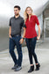 male and female models wearing ogio metro polo in blacktop and ripped red