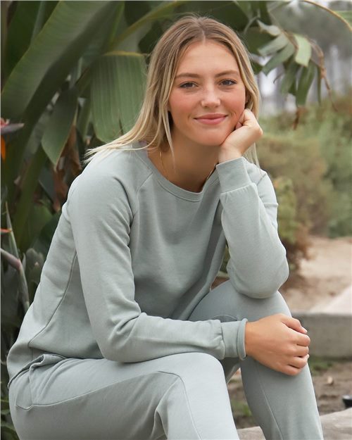 model wearing independent trading co womens california wave wash crewneck sweatshirt in sage