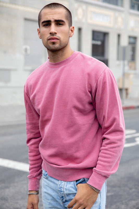 model wearing independent trading co pigment-dyed crewneck sweatshirt in maroon