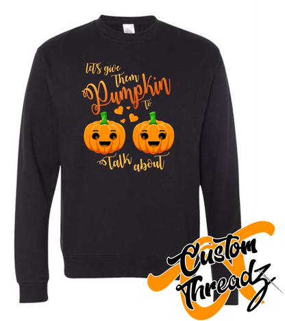 black crewneck sweatshirt with lets give them pumpkin to talk about halloween autumn fall DTG printed design