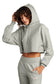 model wearing champion womens reverse weave cropped cut-off hoodie in oxford grey